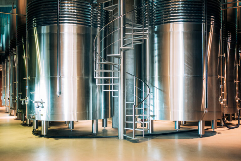 modern winery with big steel barrels scaled